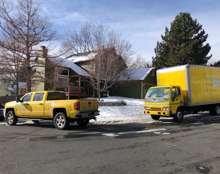 Service Master Trucks outside of a snowy home in Farmington, New Mexico